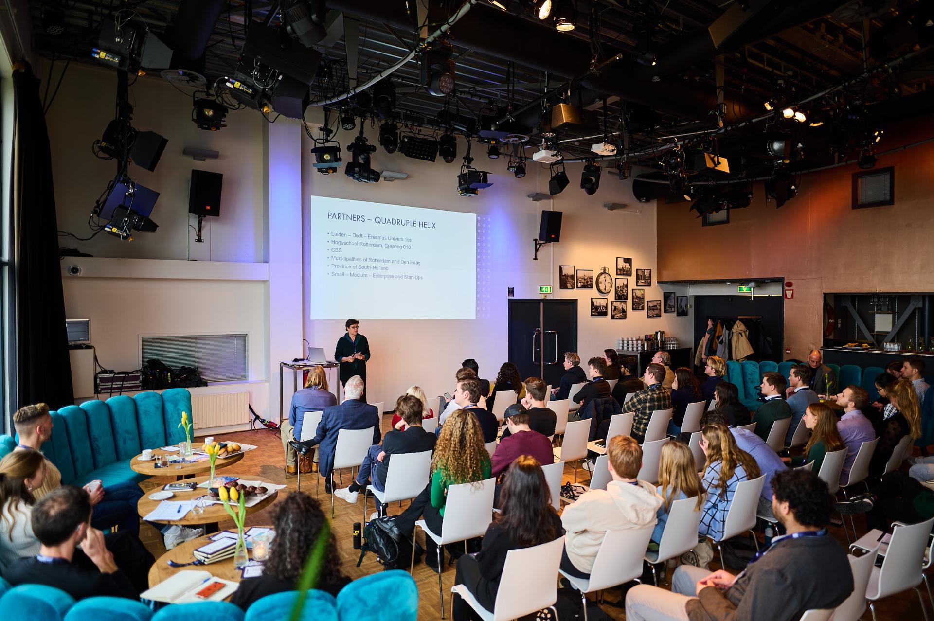 Photo of Liesbet van Zoonen talking to a room of students