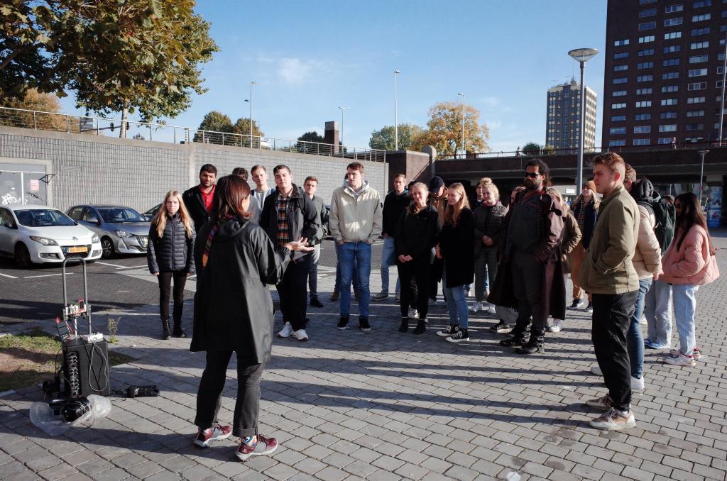 Artist Angeliki Diakrousi with a group of students