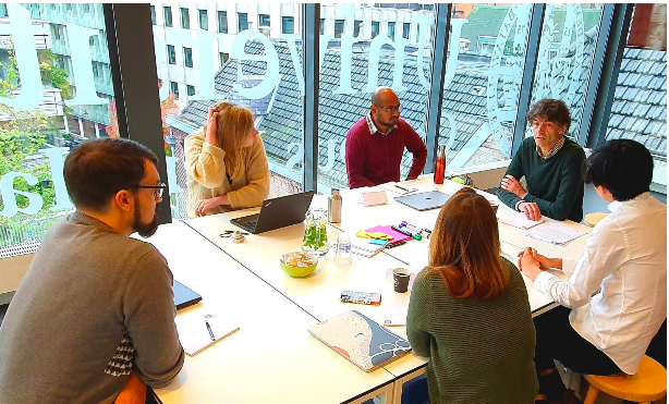 Group of researchers discussing