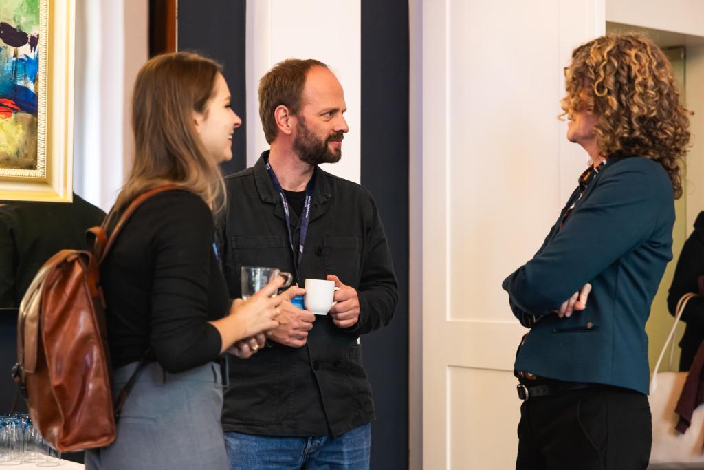 Three people talking