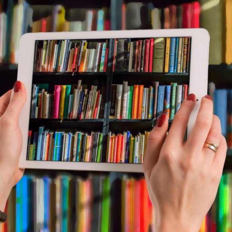 Tablet in front of books