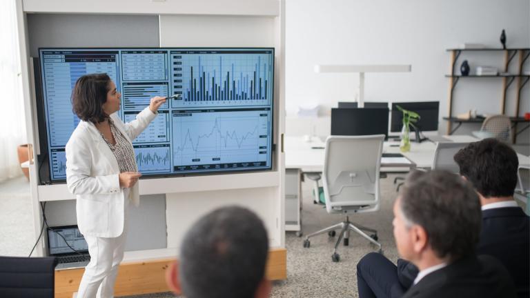 Woman in front of a data dashboard