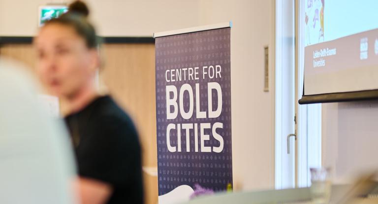 Centre for BOLD Cities banner with a person in front of it