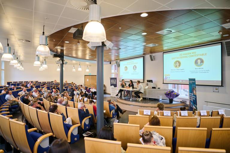 Auditorium filled with people